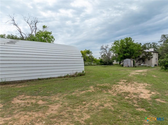 740 Old Georgetown Rd, Gatesville, TX 76528 - view of yard featuring driveway, an outbuilding, and a garage