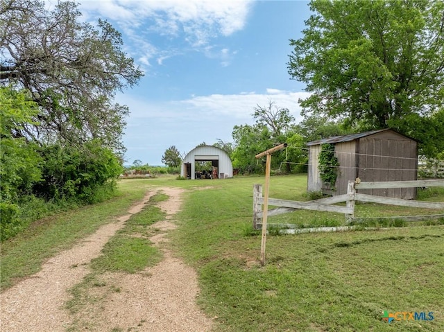 740 Old Georgetown Rd, Gatesville, TX 76528 - view of home's exterior with stucco siding, central AC, an outbuilding, and a storage unit
