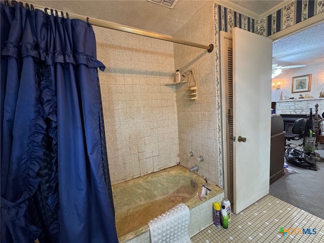 full bathroom with shower / tub combo with curtain, a fireplace, wallpapered walls, a textured ceiling, and a ceiling fan