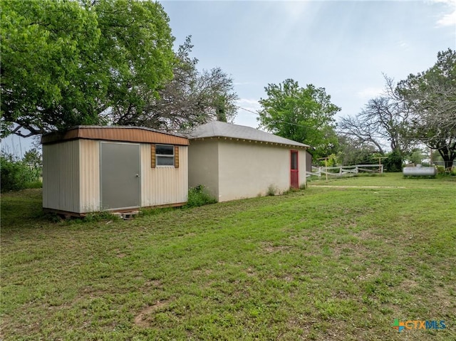 740 Old Georgetown Rd, Gatesville, TX 76528 - view of green lawn with an outbuilding, dirt driveway, and a garage