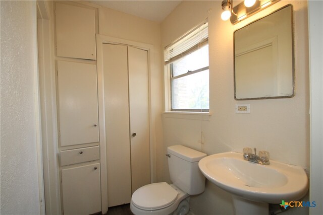 bathroom with toilet and sink