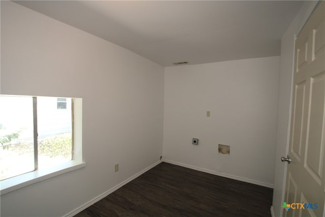 laundry area with dark hardwood / wood-style flooring, washer hookup, and hookup for an electric dryer