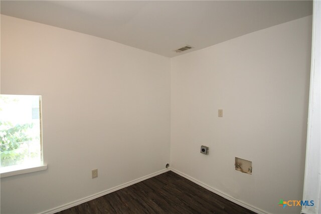 washroom featuring dark wood-type flooring, electric dryer hookup, and washer hookup