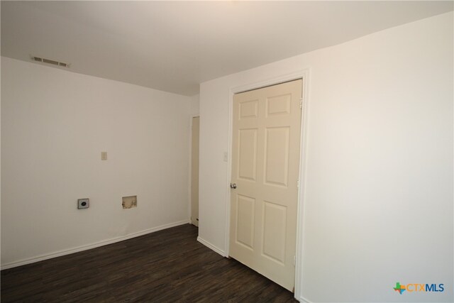 unfurnished room featuring dark hardwood / wood-style flooring