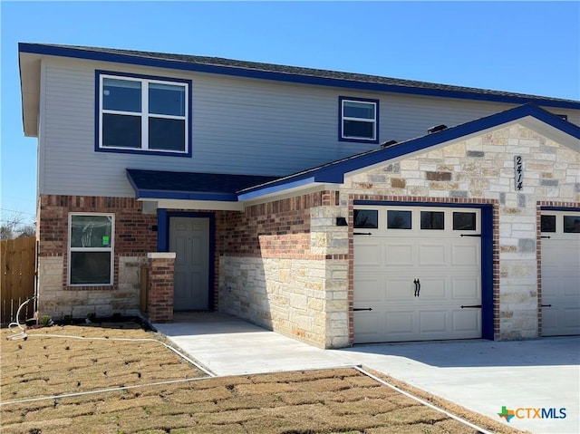 view of front of property featuring brick siding, stone siding, and fence