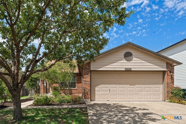 ranch-style home featuring a garage