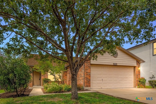 ranch-style home featuring a garage