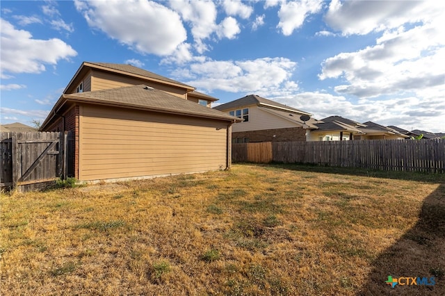 rear view of house with a lawn