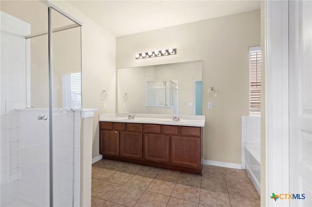 bathroom featuring separate shower and tub, a wealth of natural light, vanity, and tile patterned floors