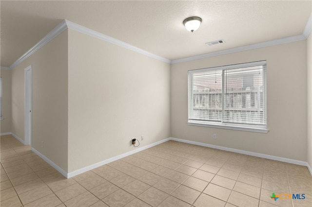 2207 Merle Dr, Copperas Cove, TX 76522 - empty room featuring light tile patterned floors and ornamental molding