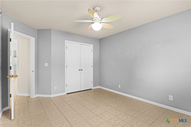 2207 Merle Dr, Copperas Cove, TX 76522 - unfurnished bedroom featuring a closet, light tile patterned flooring, and a ceiling fan