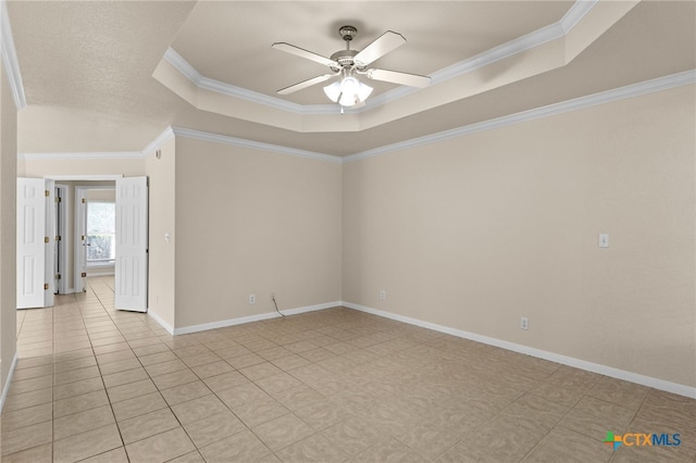 2207 Merle Dr, Copperas Cove, TX 76522 - spare room with a raised ceiling, ceiling fan, ornamental molding, and light tile patterned flooring