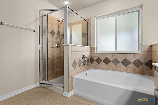 2207 Merle Dr, Copperas Cove, TX 76522 - bathroom featuring a bath, a stall shower, and tile patterned flooring