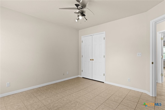 2207 Merle Dr, Copperas Cove, TX 76522 - unfurnished bedroom featuring a closet, a ceiling fan, and light tile patterned floors