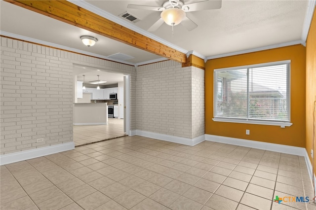 2207 Merle Dr, Copperas Cove, TX 76522 - empty room with brick wall, crown molding, ceiling fan, and tile patterned flooring