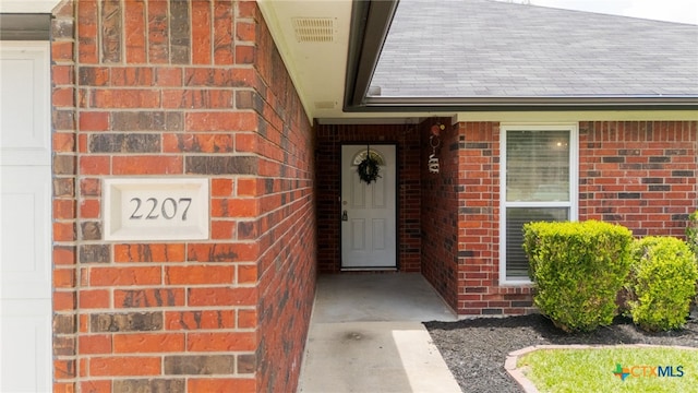2207 Merle Dr, Copperas Cove, TX 76522 - doorway to property with brick siding and roof with shingles