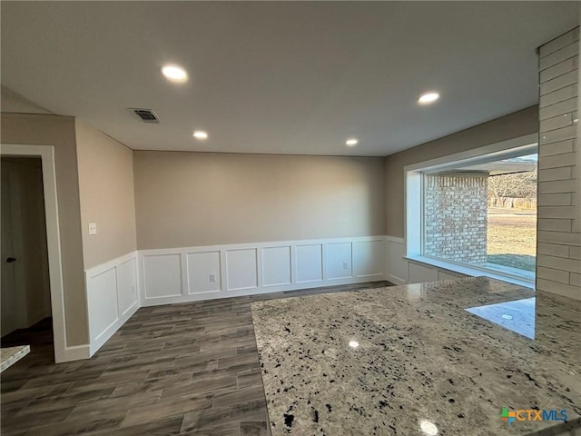 unfurnished room featuring dark hardwood / wood-style floors