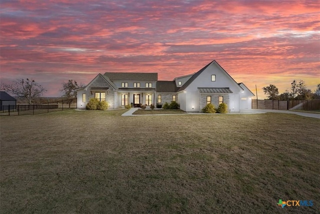 view of front of home with a yard