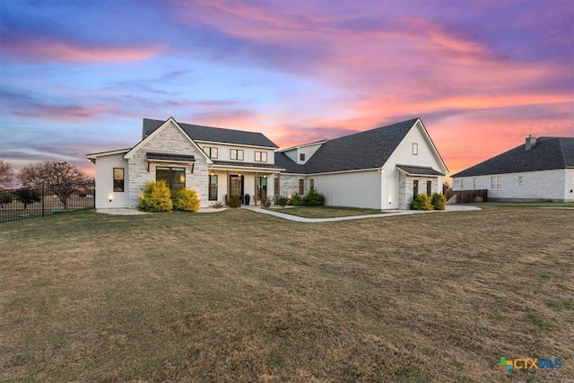 view of front of house with a lawn