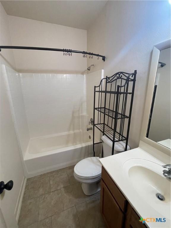 full bathroom featuring shower / tub combination, vanity, toilet, and tile patterned floors