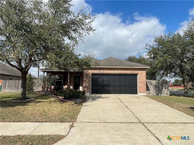 view of front of home with a garage and a front yard