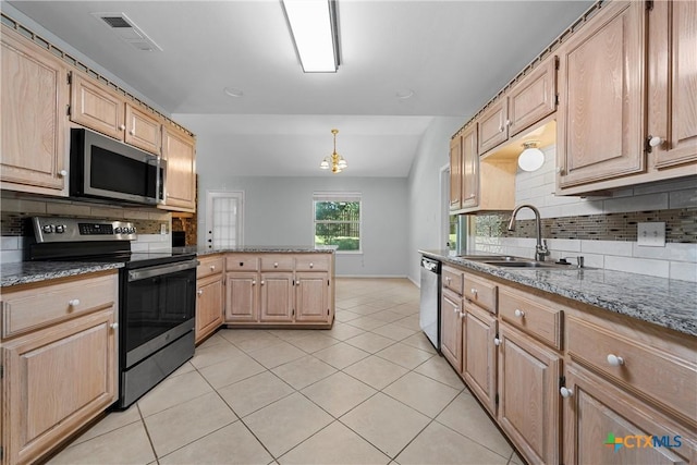 1714 Fox Trl, Harker Heights, TX 76548 - kitchen with stainless steel appliances, a sink, backsplash, a peninsula, and light tile patterned flooring