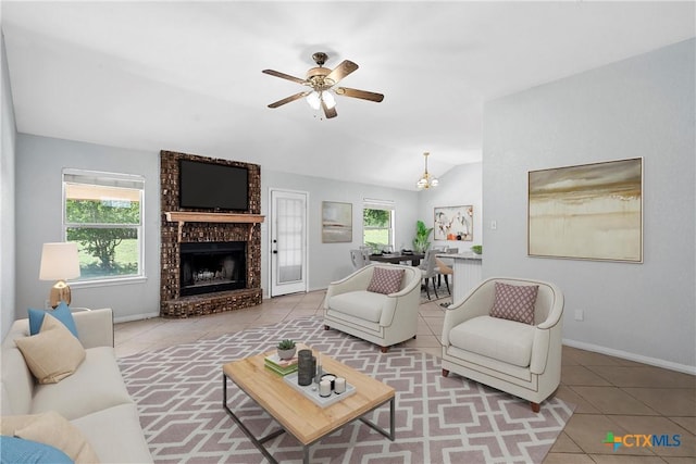 1714 Fox Trl, Harker Heights, TX 76548 - living area with tile patterned floors, ceiling fan, vaulted ceiling, a fireplace, and baseboards