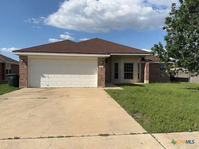 3601 Armstrong County Ct, Killeen, TX 76549 - ranch-style home featuring brick siding, driveway, an attached garage, and a front yard