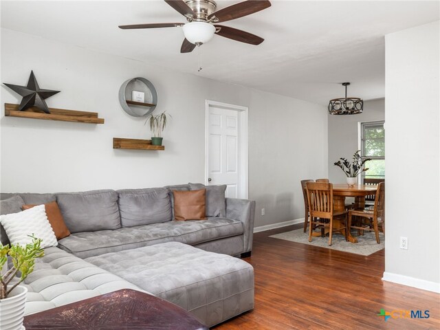 415 Brooks Mill Rd, Bertram, TX 78605 - living room with wood finished floors, a ceiling fan, and a chandelier