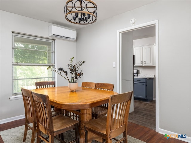 415 Brooks Mill Rd, Bertram, TX 78605 - dining space with a wall mounted air conditioner, a chandelier, and dark wood-style floors