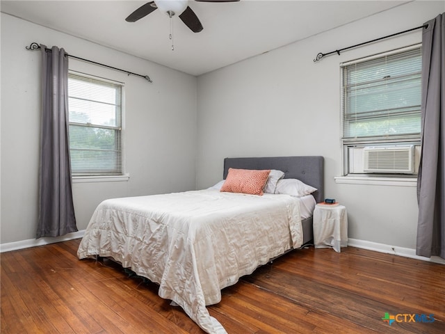 415 Brooks Mill Rd, Bertram, TX 78605 - bedroom with wood-type flooring, cooling unit, and a ceiling fan