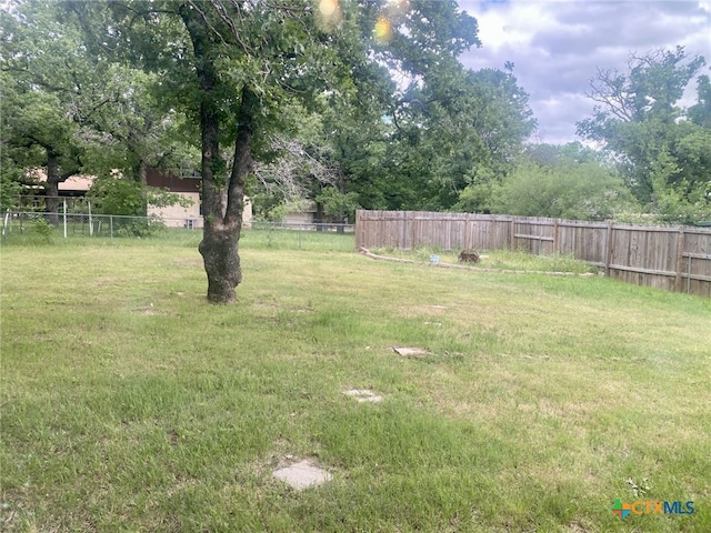 view of yard featuring fence