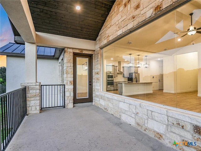 exterior entry at dusk with ceiling fan