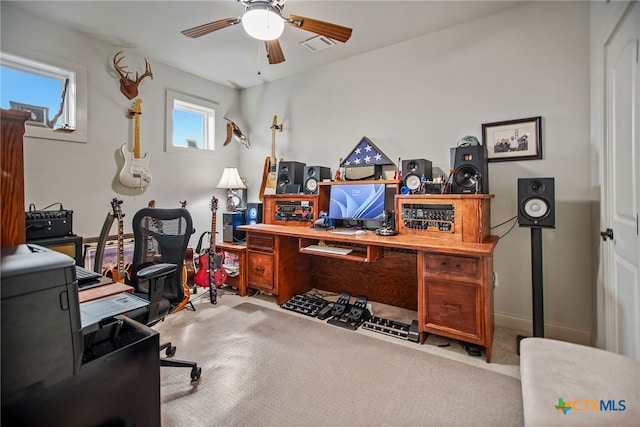 office featuring light carpet and ceiling fan