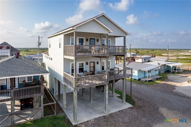 back of property with a balcony