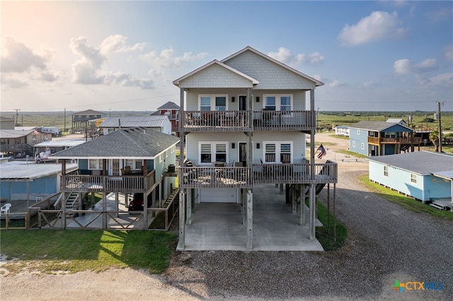 rear view of property with a balcony