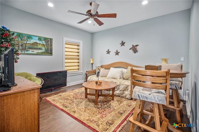 bedroom with hardwood / wood-style flooring and ceiling fan