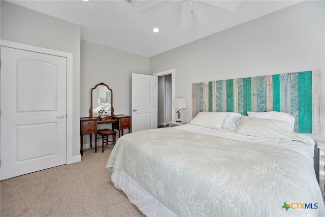 bedroom featuring light colored carpet and ceiling fan