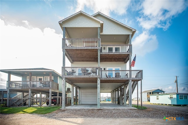 raised beach house featuring a carport