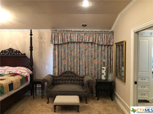 bedroom with carpet flooring, crown molding, and vaulted ceiling