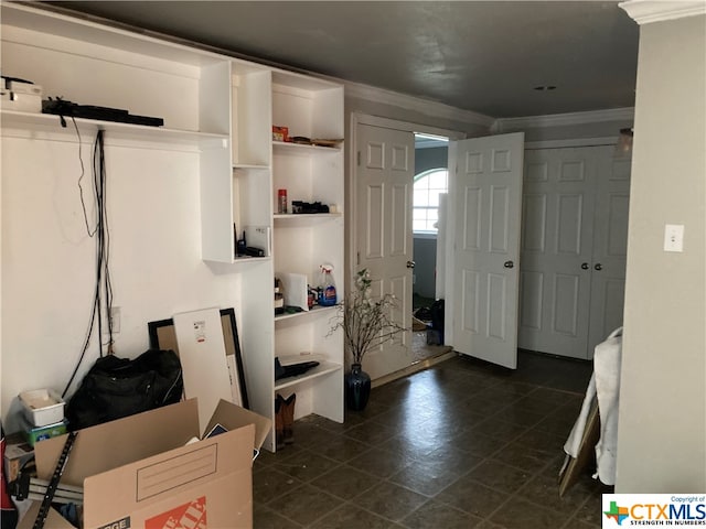 interior space with crown molding