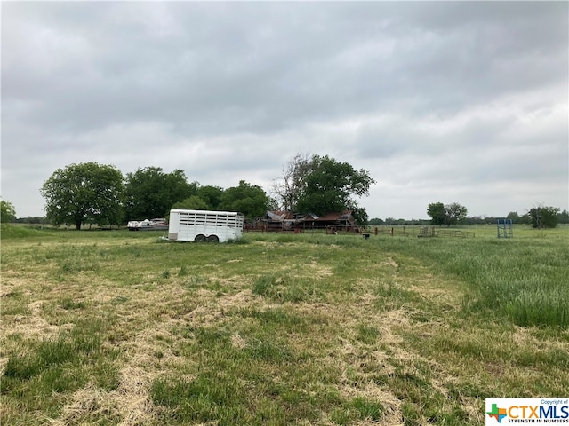 view of yard with a rural view