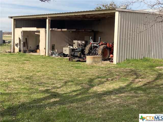 view of outdoor structure with a lawn