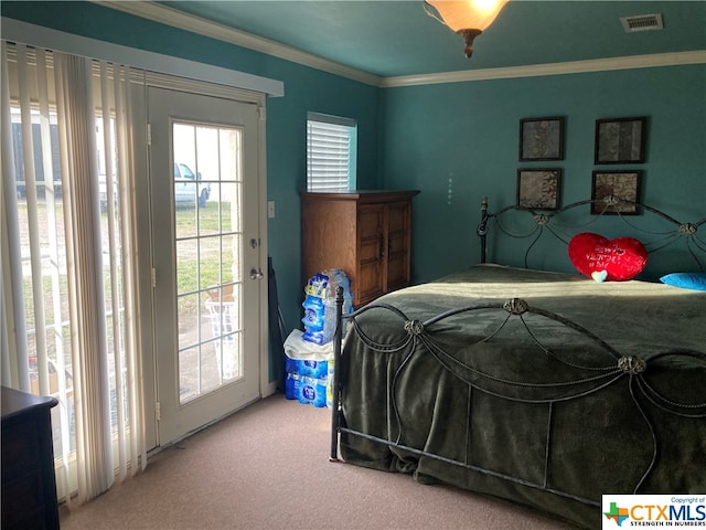 carpeted bedroom featuring crown molding and access to exterior