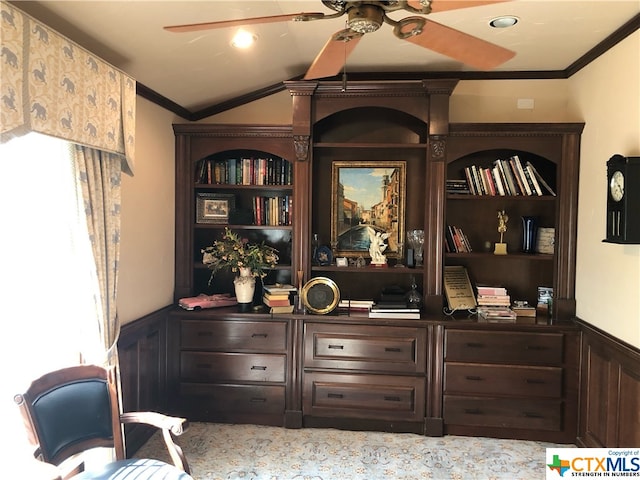 interior space featuring ornamental molding, plenty of natural light, ceiling fan, and dark brown cabinets