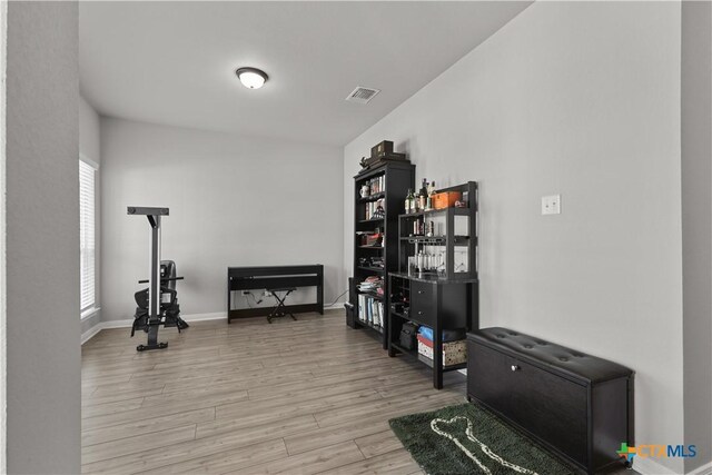 7005 Mcgregor Loop, Killeen, TX 76549 - living area with light wood-style floors and baseboards