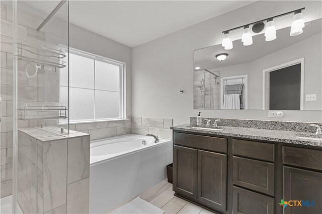 7005 Mcgregor Loop, Killeen, TX 76549 - full bath featuring a stall shower, a bath, and double vanity
