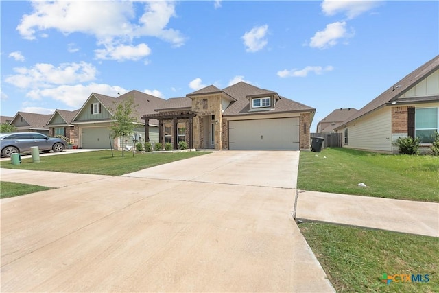 7005 Mcgregor Loop, Killeen, TX 76549 - view of front facade with brick siding, a front lawn, concrete driveway, and an attached garage