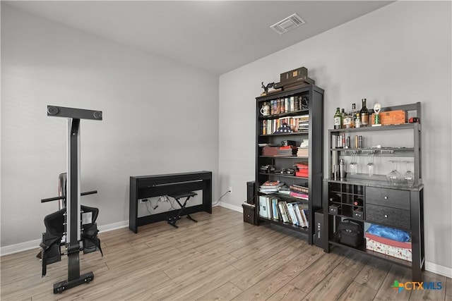 7005 Mcgregor Loop, Killeen, TX 76549 - miscellaneous room featuring wood finished floors and a dry bar