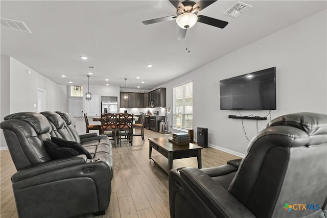 7005 Mcgregor Loop, Killeen, TX 76549 - living room with ceiling fan, light wood finished floors, and recessed lighting